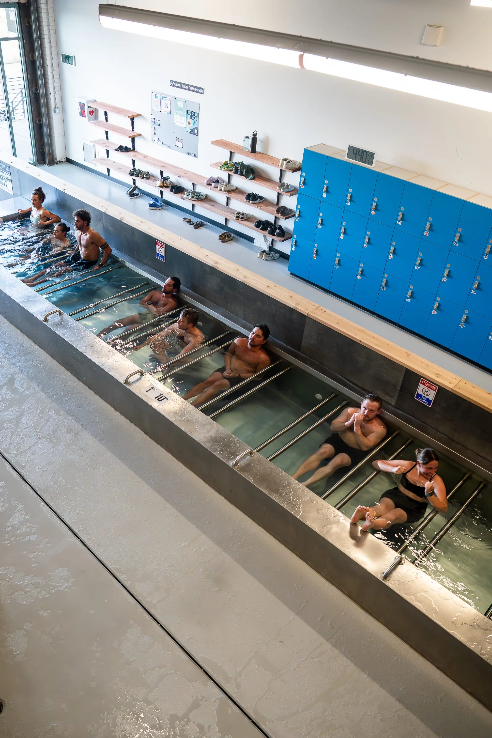 Members side by side in the Denver cold plunge