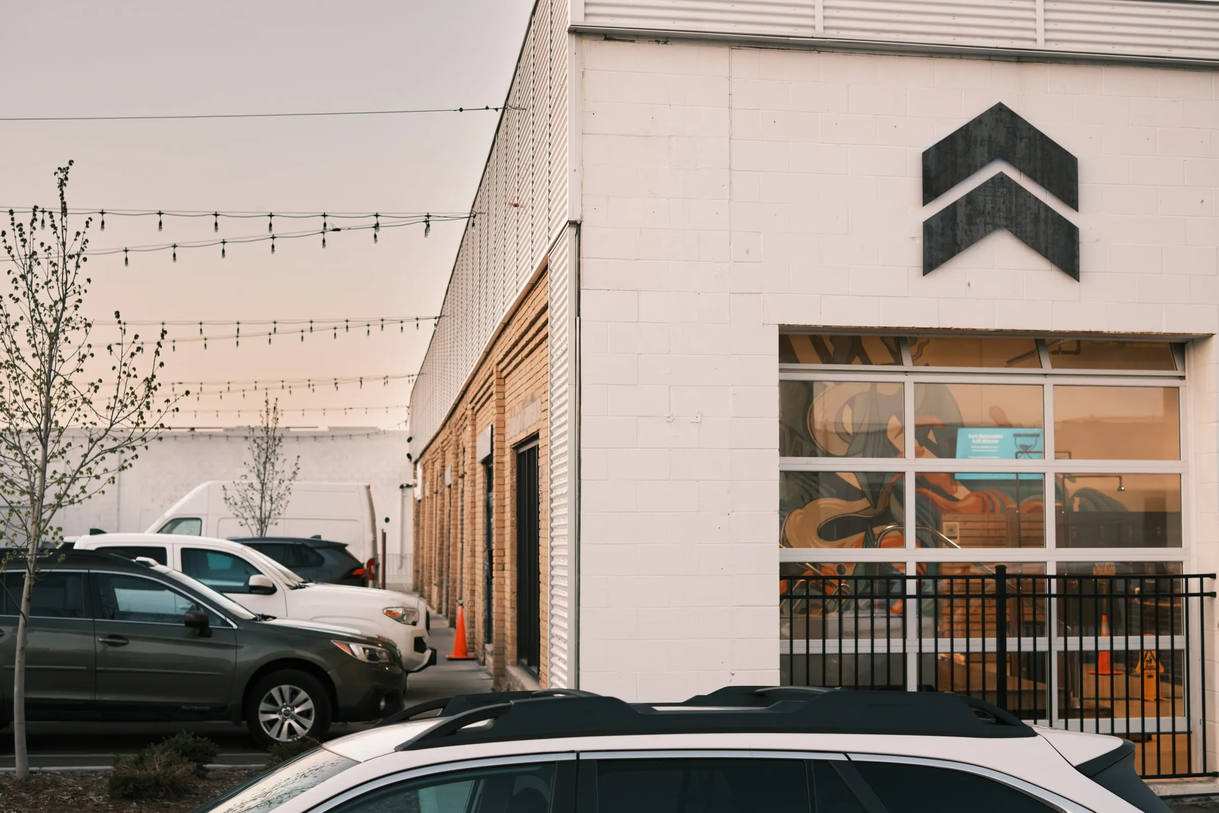 The Embrace North brick building in Marcy Holmes with the chevron logo